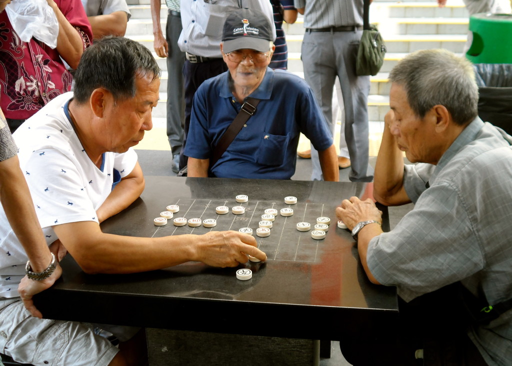 Old men playing chess in Singapore.