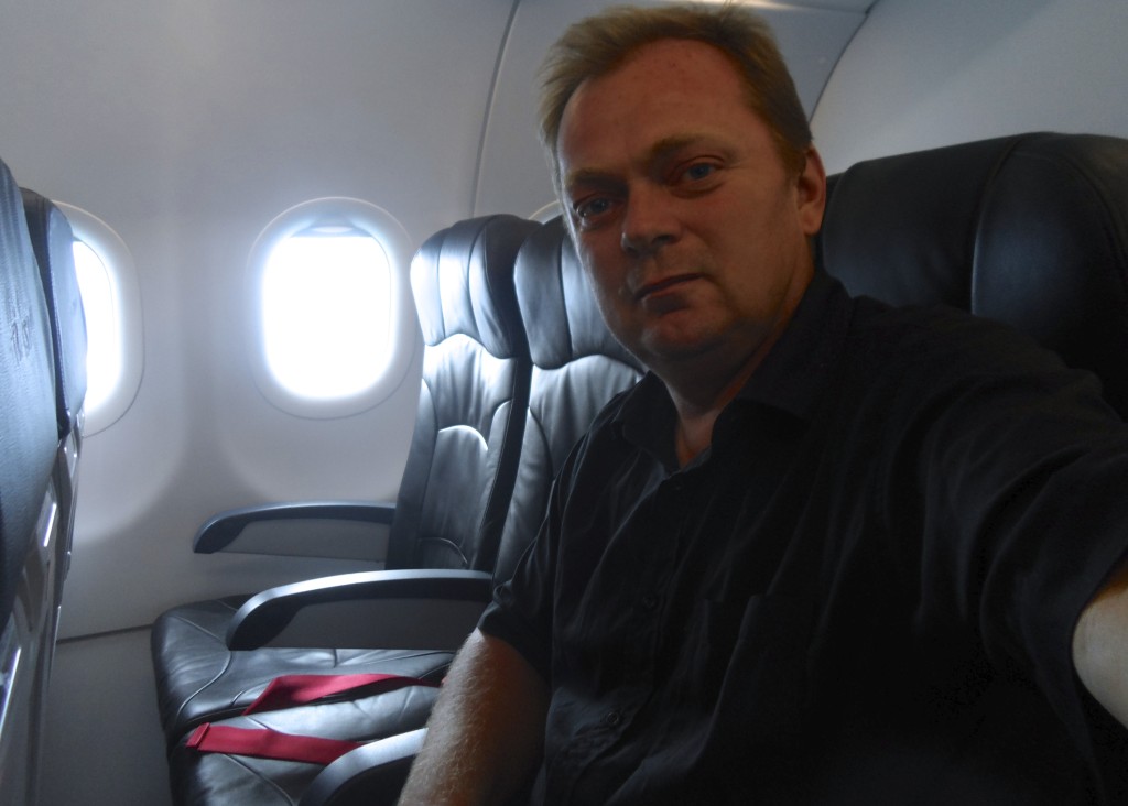 Me taking a selfie onboard Air Asia.