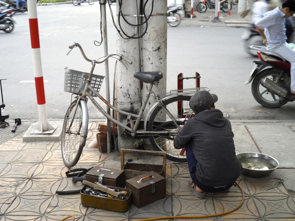 Roadside bicycle mechanic in Vietnam.
