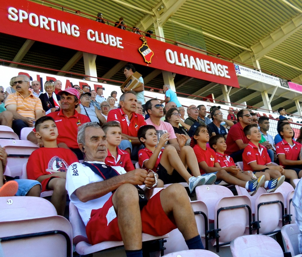 People of all ages at the football stadium in Olhao.