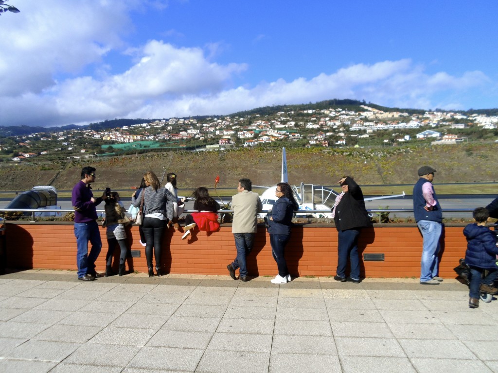 People at the observation deck at Madeira Airport.