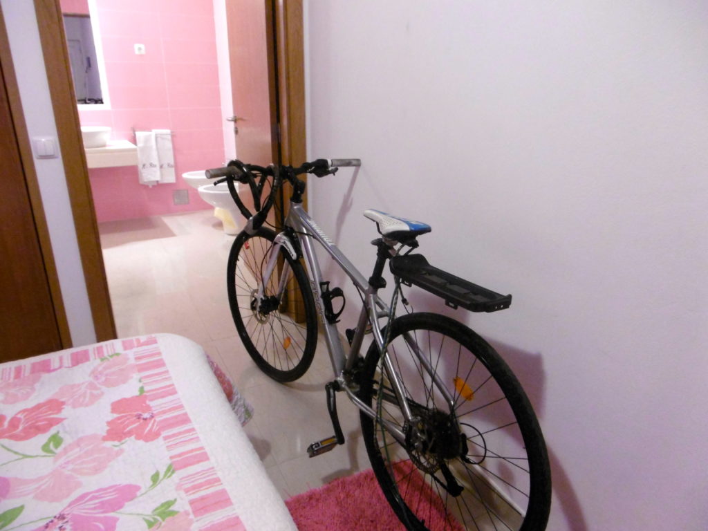 My broken bicycle in my hotel room.