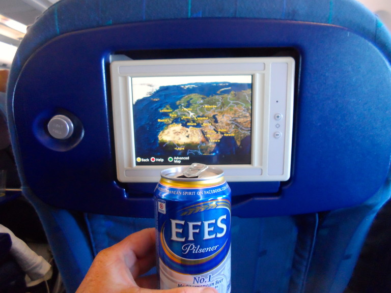 Fly, drink beer and have an empty seat next to you.