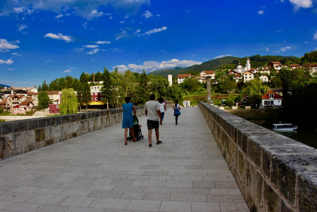 Local Visegrad inhabitants walking across the bridge.